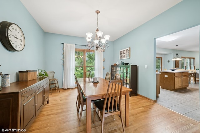 462 Kelly Ln, Crystal Lake, IL 60012 - dining room featuring healthy amount of natural light, light wood finished floors, and a chandelier