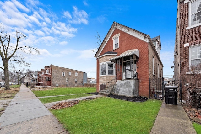 5241 W Adams St, Chicago, IL 60644 - view of side of home with a lawn and brick siding
