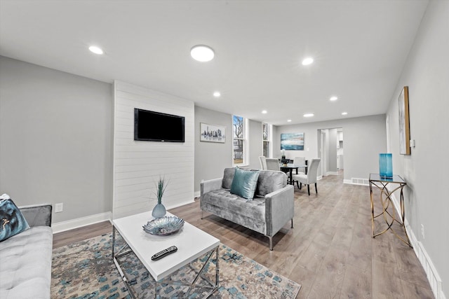 5241 W Adams St, Chicago, IL 60644 - living area featuring light wood-style floors and recessed lighting
