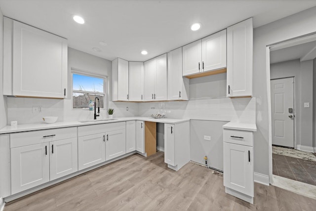 5241 W Adams St, Chicago, IL 60644 - kitchen featuring white cabinetry, light wood-type flooring, and recessed lighting
