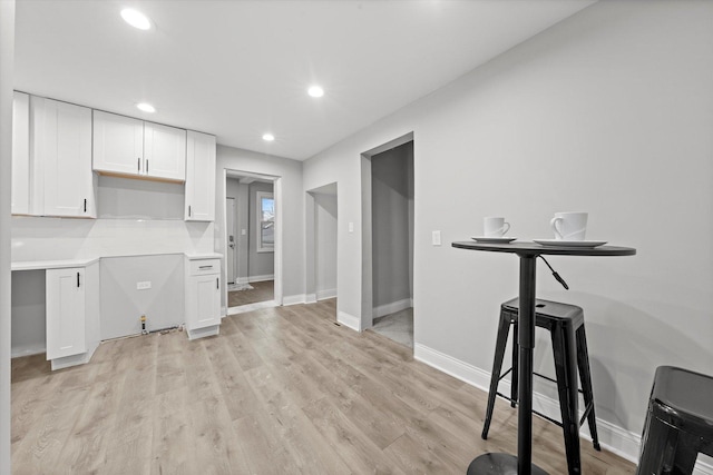 5241 W Adams St, Chicago, IL 60644 - kitchen with white cabinetry, recessed lighting, light wood-style floors, and light countertops