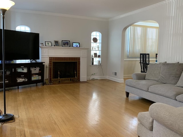 4520 N Austin Ave, Chicago, IL 60630 - living room with wood-type flooring, healthy amount of natural light, arched walkways, and ornamental molding