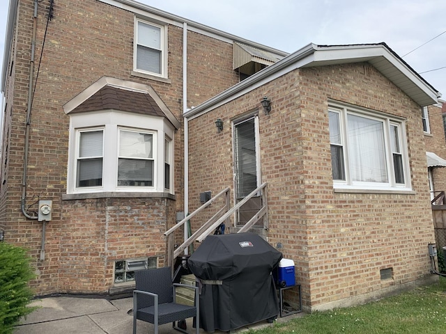 4520 N Austin Ave, Chicago, IL 60630 - view of side of property featuring brick siding and a patio area
