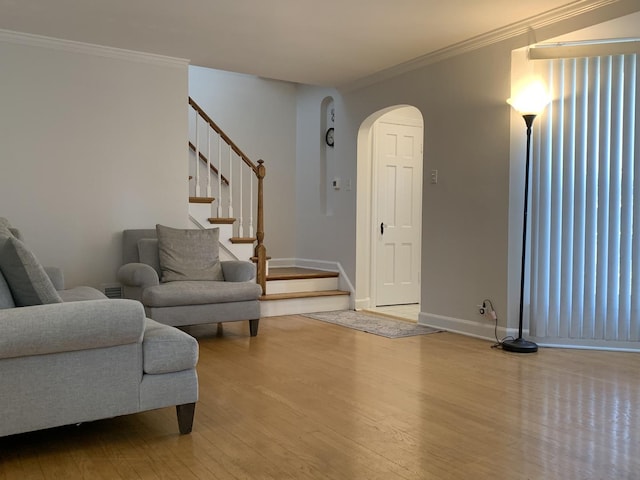 4520 N Austin Ave, Chicago, IL 60630 - living room with arched walkways, wood finished floors, ornamental molding, and stairs