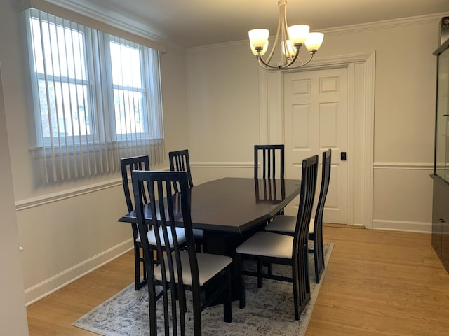 4520 N Austin Ave, Chicago, IL 60630 - dining space with a chandelier, light wood-style floors, and crown molding