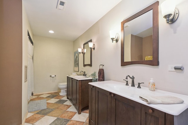 8414 W 119th St, Palos Park, IL 60464 - full bathroom with two vanities, recessed lighting, and stone finish floors
