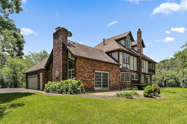 8414 W 119th St, Palos Park, IL 60464 - view of side of home with a chimney, a yard, a garage, concrete driveway, and roof with shingles