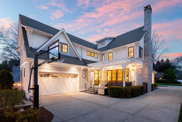 33 N Fremont St, Naperville, IL 60540 - modern inspired farmhouse featuring driveway, a pergola, board and batten siding, a chimney, and a shingled roof