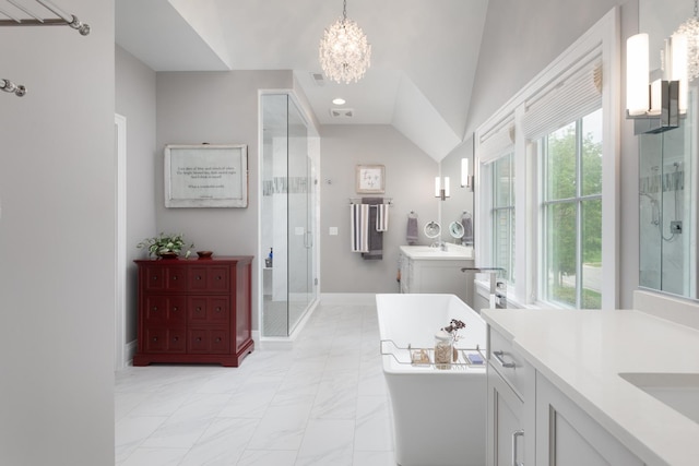 33 N Fremont St, Naperville, IL 60540 - full bathroom featuring a chandelier, a shower stall, two vanities, a soaking tub, and lofted ceiling