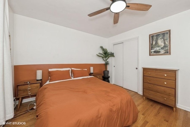 4030 N Mozart St Unit 3N, Chicago, IL 60618 - bedroom with light wood-style flooring, a closet, and a ceiling fan