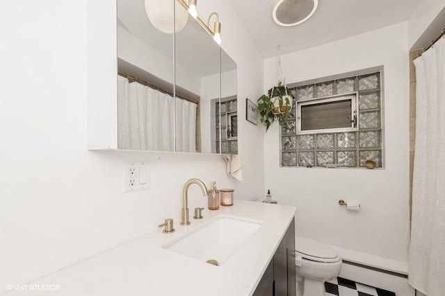 4030 N Mozart St Unit 3N, Chicago, IL 60618 - bathroom with vanity, a baseboard heating unit, and a shower with curtain