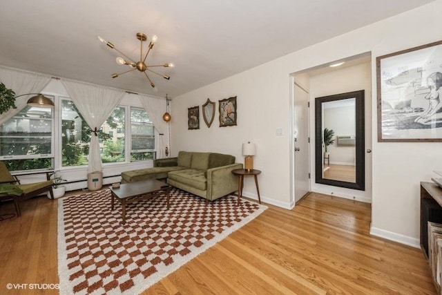 4030 N Mozart St Unit 3N, Chicago, IL 60618 - living area featuring a chandelier and light wood-style flooring