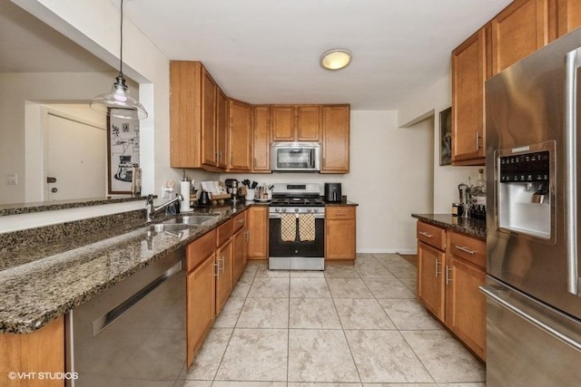 4030 N Mozart St Unit 3N, Chicago, IL 60618 - kitchen featuring appliances with stainless steel finishes, brown cabinetry, and dark stone counters