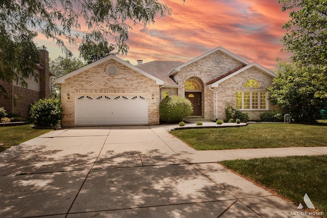 1196 Covington Dr, Lemont, IL 60439 - view of front of home featuring brick siding, driveway, a front lawn, and a garage