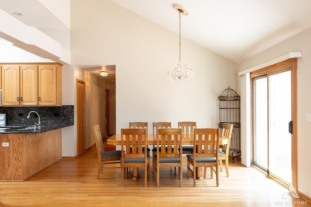 1196 Covington Dr, Lemont, IL 60439 - dining space featuring light wood finished floors, a chandelier, and high vaulted ceiling