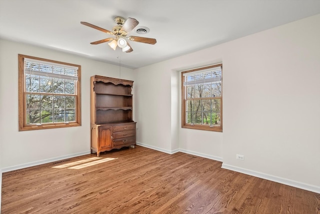 125 Grove Ln, Barrington, IL 60010 - unfurnished room with wood finished floors and a ceiling fan