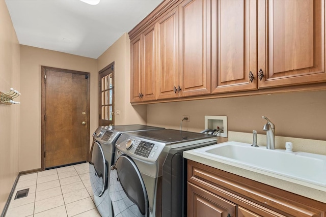 125 Grove Ln, Barrington, IL 60010 - laundry room featuring cabinet space, independent washer and dryer, and light tile patterned flooring