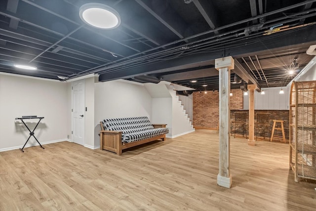 125 Grove Ln, Barrington, IL 60010 - finished basement featuring brick wall, wood finished floors, and stairway