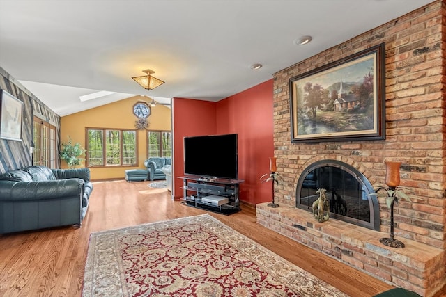 125 Grove Ln, Barrington, IL 60010 - living room featuring lofted ceiling, wood finished floors, and a brick fireplace