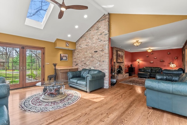125 Grove Ln, Barrington, IL 60010 - living room featuring high vaulted ceiling, wood finished floors, french doors, ceiling fan, and beamed ceiling