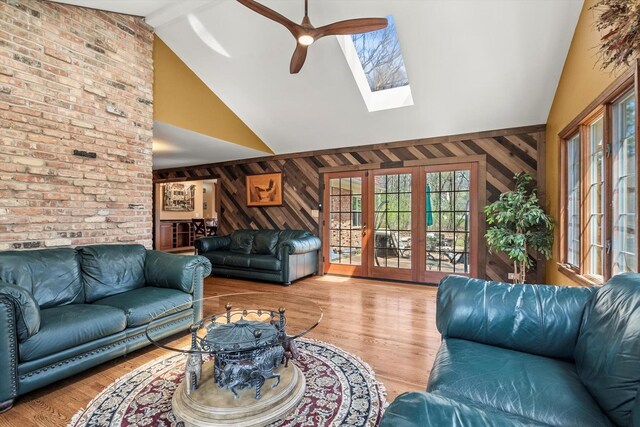 125 Grove Ln, Barrington, IL 60010 - living area featuring wooden walls, plenty of natural light, ceiling fan, high vaulted ceiling, and wood finished floors