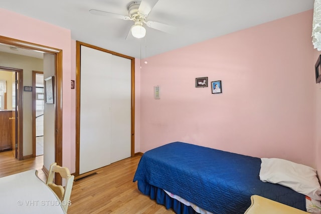 8411 Mansfield Ave, Morton Grove, IL 60053 - bedroom with light wood-type flooring, a ceiling fan, and a closet