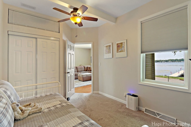 25134 W Lake Shore Dr, Ingleside, IL 60041 - bedroom with carpet, a closet, a water view, and ceiling fan