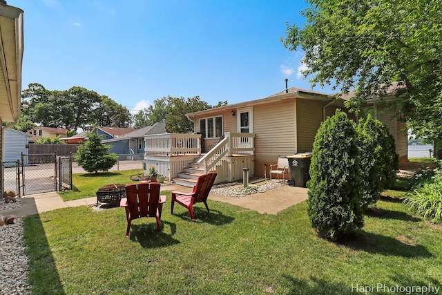 25134 W Lake Shore Dr, Ingleside, IL 60041 - view of yard with a fire pit, a deck, stairs, and a gate