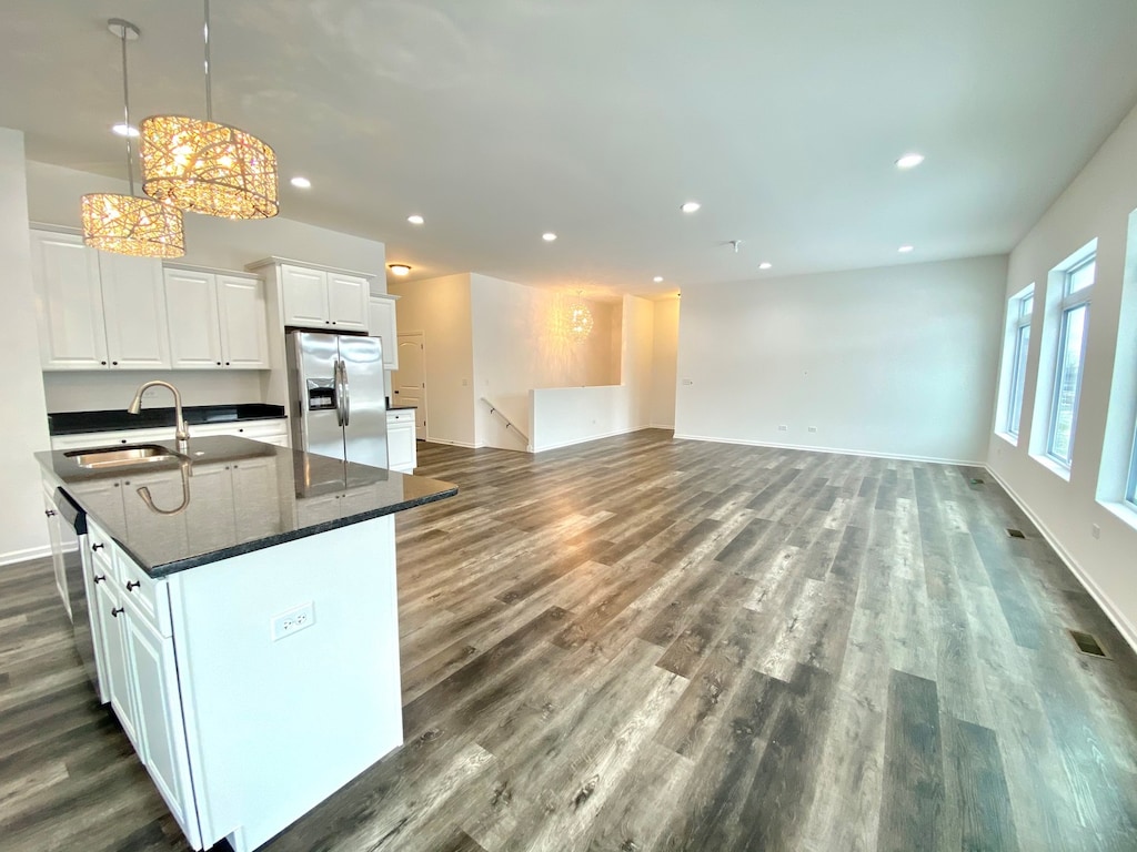 26824 W Old Kerry, Channahon, IL 60410 - kitchen with appliances with stainless steel finishes, dark wood-type flooring, recessed lighting, an island with sink, and white cabinetry