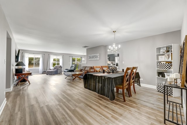 739 Glen Cove Ln, Pingree Grove, IL 60140 - living room featuring a chandelier and light wood-style flooring