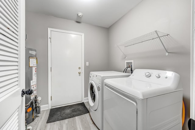 739 Glen Cove Ln, Pingree Grove, IL 60140 - washroom featuring separate washer and dryer, light wood-type flooring, and water heater