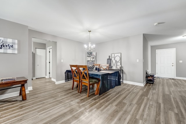 739 Glen Cove Ln, Pingree Grove, IL 60140 - dining room featuring light wood-style floors and a chandelier