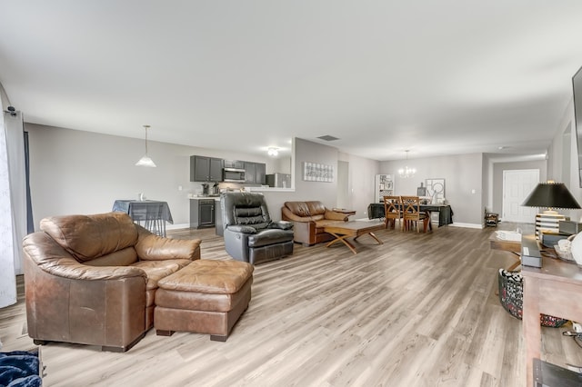 739 Glen Cove Ln, Pingree Grove, IL 60140 - living area featuring light wood-style flooring and a chandelier