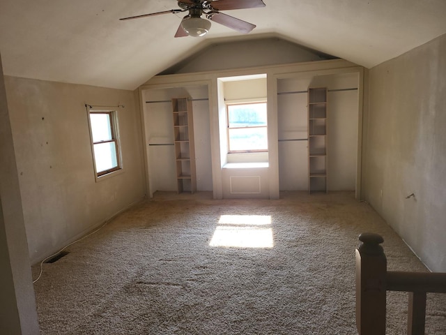 67 S Somonauk Rd, Cortland, IL 60112 - unfurnished bedroom featuring lofted ceiling, carpet, ceiling fan, and two closets