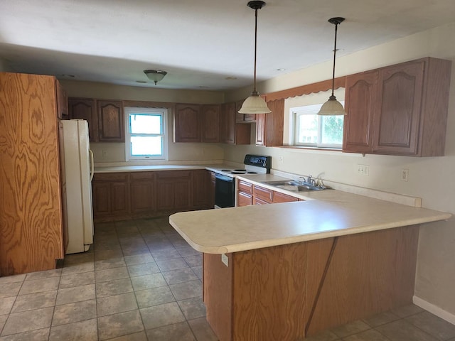 67 S Somonauk Rd, Cortland, IL 60112 - kitchen featuring electric stove, freestanding refrigerator, a peninsula, light countertops, and decorative light fixtures