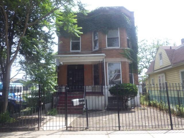 6527 S Marshfield Ave, Chicago, IL 60636 - view of front of property with a fenced front yard, a gate, and covered porch