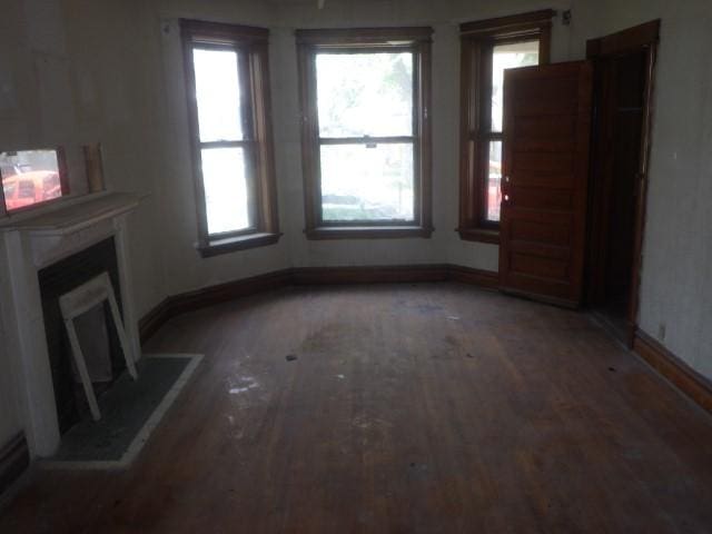 6527 S Marshfield Ave, Chicago, IL 60636 - unfurnished living room with light wood-style floors and a fireplace