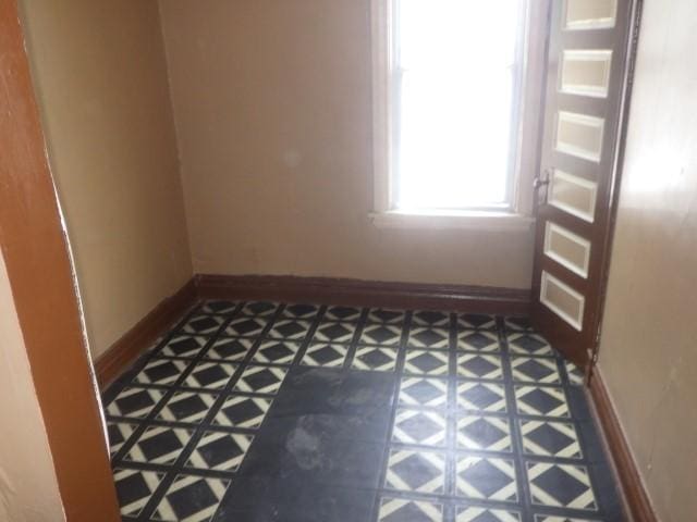 6527 S Marshfield Ave, Chicago, IL 60636 - empty room featuring tile patterned floors and baseboards