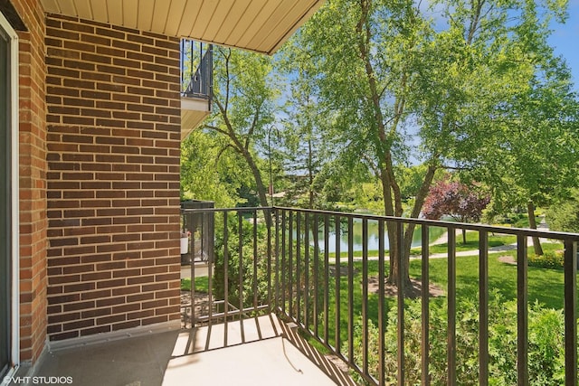 1127 S Old Wilke Rd Unit 201, Arlington Heights, IL 60005 - balcony with a water view and view of wooded area