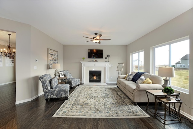 26944 W Old Kerry, Channahon, IL 60410 - living room with ceiling fan, a glass covered fireplace, a chandelier, and dark wood-style flooring