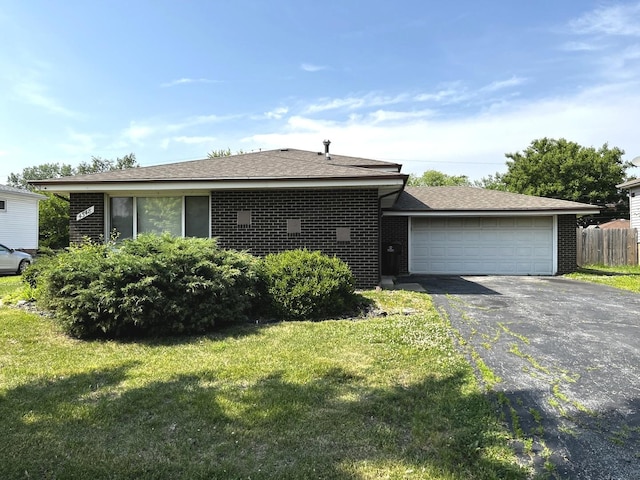 4348 Mann St, Oak Forest, IL 60452 - view of front of house featuring brick siding, driveway, and a garage