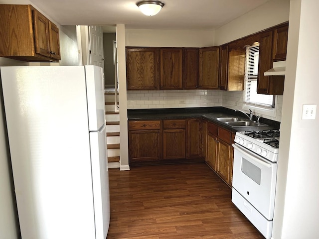 4348 Mann St, Oak Forest, IL 60452 - kitchen with white appliances, custom exhaust hood, dark countertops, dark wood-style floors, and decorative backsplash