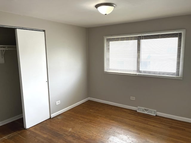 4348 Mann St, Oak Forest, IL 60452 - unfurnished bedroom featuring hardwood / wood-style flooring and a closet
