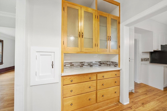 9209 S Hoyne Ave, Chicago, IL 60643 - kitchen with light wood finished floors, decorative backsplash, light countertops, and glass insert cabinets