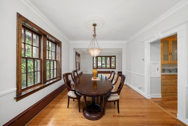 9209 S Hoyne Ave, Chicago, IL 60643 - dining space featuring light wood-style floors, plenty of natural light, ornamental molding, and a baseboard radiator