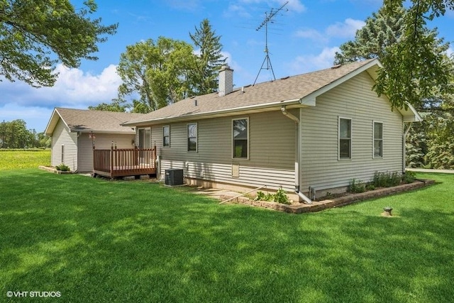 12501 Hebron Rd, Hebron, IL 60034 - rear view of property with a deck, a yard, and a chimney