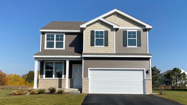 1511 Aspen Ln, Pingree Grove, IL 60140 - craftsman-style home featuring driveway, a front lawn, a garage, and brick siding