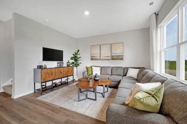 1511 Aspen Ln, Pingree Grove, IL 60140 - living area featuring healthy amount of natural light, wood finished floors, recessed lighting, and stairway