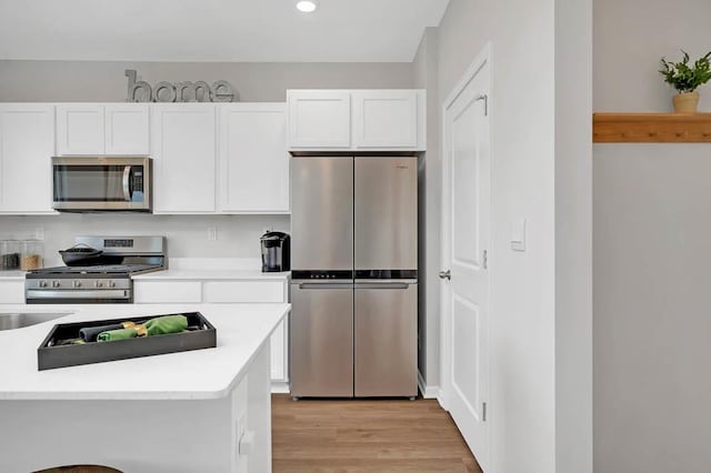 1511 Aspen Ln, Pingree Grove, IL 60140 - kitchen with appliances with stainless steel finishes, white cabinetry, light countertops, and recessed lighting