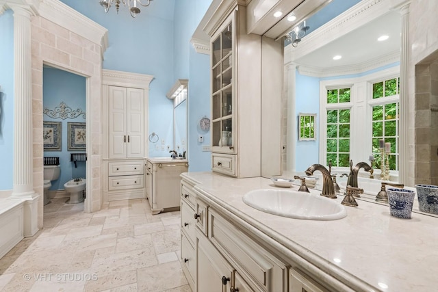 33W551 Hub Rd, Wayne, IL 60184 - full bath featuring a bidet, two vanities, stone tile floors, decorative columns, and ornamental molding